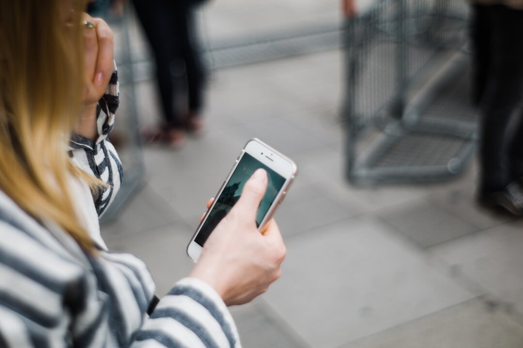 person scrolling social media on phone
