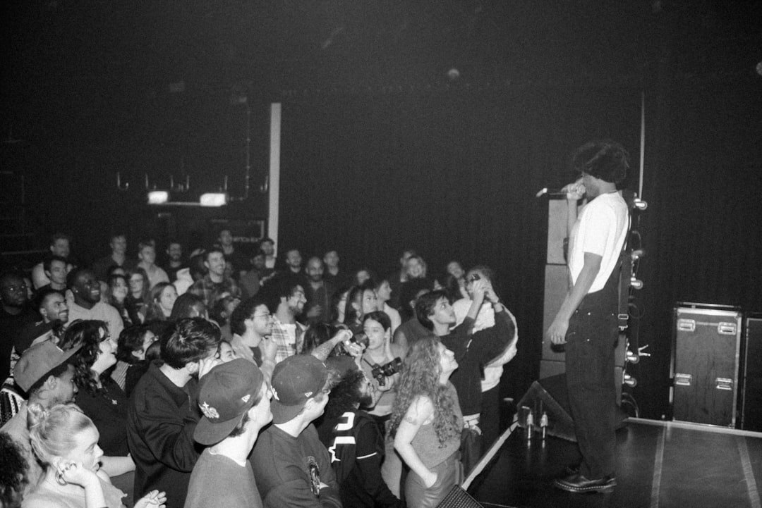 celebrity on stage addressing crowd